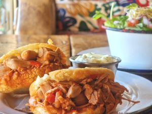 Arepas – Fried cornmeal bread stuffed with peppers, onion, corriander and garlic with  pulled jackfruit and a garlic and herb dipping sauce at Project Social in Ibiza