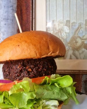 MARLEY - Cauliflower, lentils, kidney bean, seeds, and curry paste patty with mango salsa on a 100% spelt bun at Project Social in Ibiza