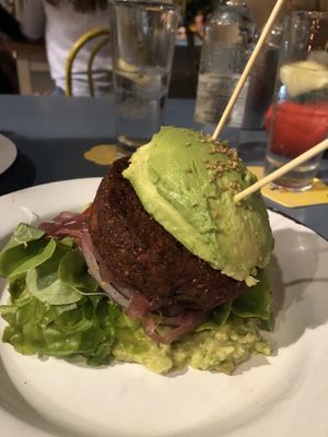 Bean burger with avocado bun at Project Social in Ibiza