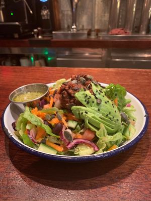 Jack fruit salad, cucumber, lettuce, onion, tomato, carrot, pulled BBQ jack fruit, avocado, pumpkin seeds, black beans and a lime and corriander dressing at Project Social in Ibiza