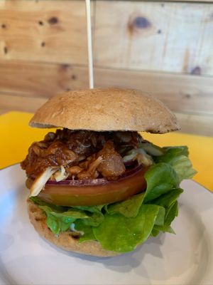 PULLED JACK  BBQ pulled jack fruit, gherkins and coleslaw on spelt bun at Project Social in Ibiza