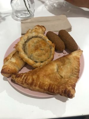 Cheese roll-up, guava and cheese pastelito, “meat” pastelito, and jackfruit croquetas at Ali's Sweet Treats in Miami