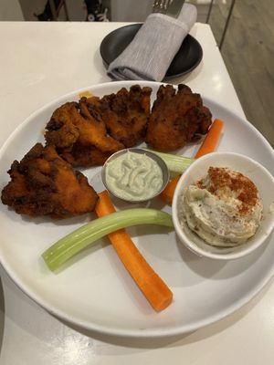 Buffalo wings (deep fried in batter)    at P.S. Kitchen in New York City