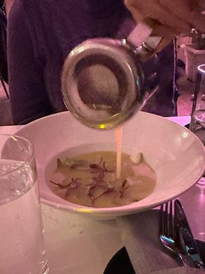 Potato soup (mid pour)  at P.S. Kitchen in New York City