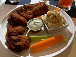 Maitake mushrooms wings in buffalo sauce with potatoes salad.  at P.S. Kitchen in New York City