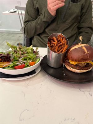 Beyond BBQ burger, sweet potato fries and side salad. at P.S. Kitchen in New York City