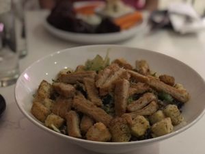 Caesar salad with crispy “chicken"  at P.S. Kitchen in New York City