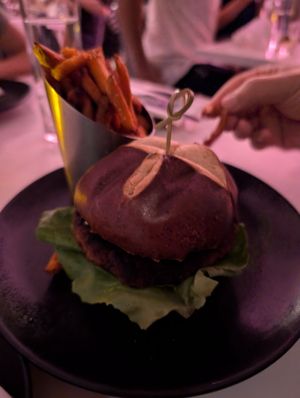 Black & blue burger, side of sweet potato fries at P.S. Kitchen in New York City
