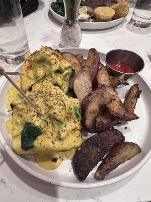 Eggs Florentine with potatoes  at P.S. Kitchen in New York City