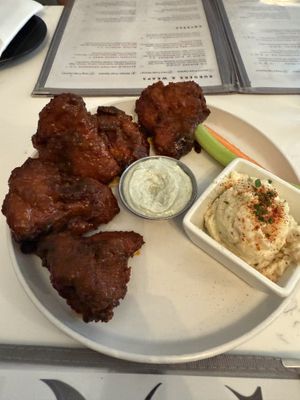 Miatake mushrooms with buffalo sauce, blue cheese, and potato saladd  at P.S. Kitchen in New York City
