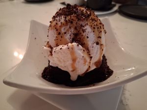 Chocolate Brownie with Cashew Caramel, Coconut Ice Cream, and Chocolate Sauce. at P.S. Kitchen in New York City