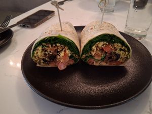 Organic Tofu Scramble, Spinach, Smokey Mushrooms, Tomato, and Chipotle Mayo wrapped in a Flour Tortilla. at P.S. Kitchen in New York City