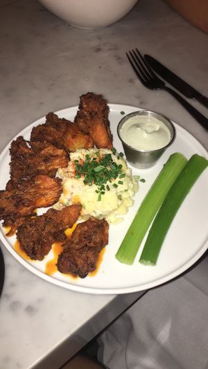 Vegan buffalo cauliflower wings and potato salad!! at P.S. Kitchen in New York City