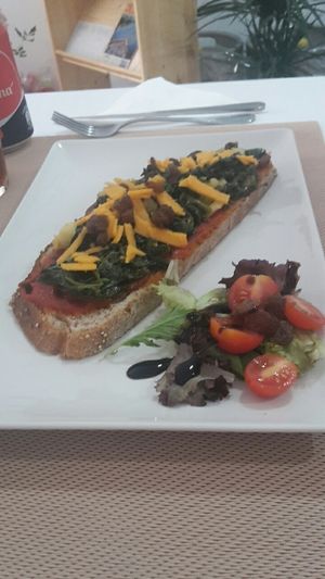 Tostada de espinacas con queso vegano. at El Secret in Falset