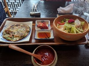 Bibimbap set meal. Red lepepper sauce, salad, kimchi, soy dip, green onion pancake (small) at Minari in Kyoto