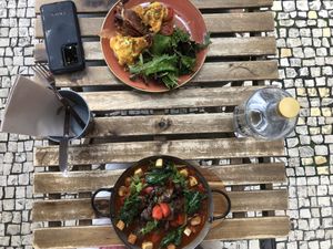 Vegan ShakShuka on the bottom.  Omnivore’s eggs Benedict on the top. at Zenith in Porto