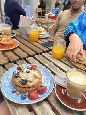 In Front the vegan pancake and caramel latte with almond milk at Zenith in Porto