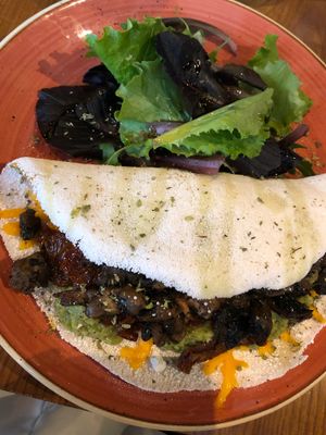 Gluten free began pancake with avocado, mushrooms, sundries tomatoes and vegan cheese at Zenith in Porto