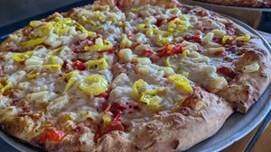 Built a pizza with vegan cheese. This is a large. at Backwoods Brewing Company in Carson