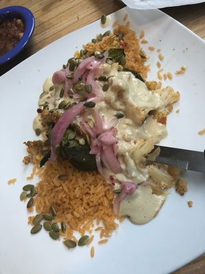 Definitely get the vegan cauliflower stuffed poblano with mole blanco!! Unbelievably tasty. On the vegan menu.  at Ed's Cantina & Grill in Estes Park