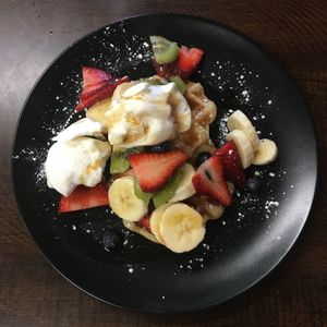 I requested the vegan waffles and added soy ice cream, maple syrup and fruit. They were very accommodating!  at Red Brik caffe in Albury
