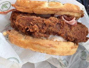 Chicken and waffle sandwich (vegan chicken patty, vegan bacon, and maple aioli all between two waffle buns) at Plant Power Fast Food - Encinitas in Encinitas