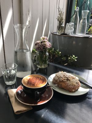 Cappuccino And almond pan au chocolate  at Gathered Kitchen in Glebe
