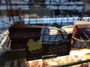 Cake display. Use google translate or ask server to translate. at Love It Raw in Bucharest