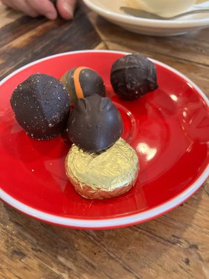 Coffee comes with gold wrapped vg chocolate, we ordered 4 more !  at Mocha in Richmond