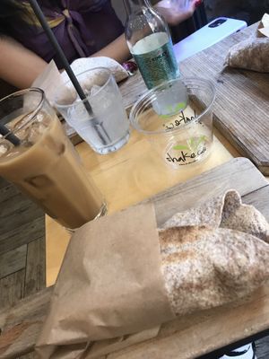  Vegan hummus wrap and iced coffee with almond milk  at Shake Cafe - Del Corso in Florence
