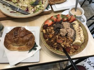 vegan chocolate smoothie bowl with toppings& vegan croissant with jam at Shake Cafe - Del Corso in Florence