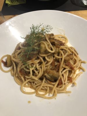 Spaghetti con melanzane su crema di mandorle e aneto  at Olivia Natural Bistrot in Siracusa