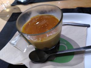 Cheesecake with mango sauce on top at Olivia Natural Bistrot in Siracusa