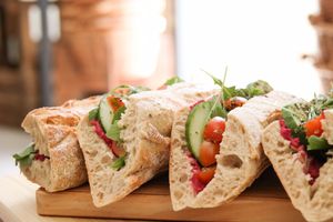 Vegan Sandwich with Beetroot hummus, cucumber, rucula and cherry tomatos!  at Mercearia da Mila in Lisbon