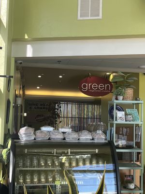 Bakery case with huge cinnamon roll deliciousness stacked on top  at Green Vegetarian Cuisine - Quarry Market in San Antonio