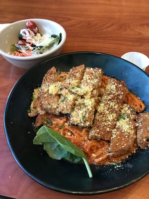 Eggplant Parmesan with a small side salad topped with Poblano ranch. at Green Vegetarian Cuisine - Quarry Market in San Antonio