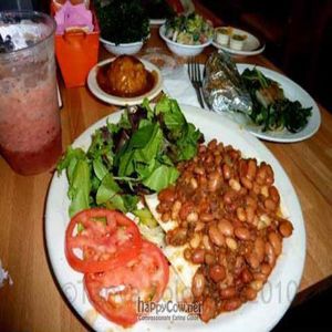 Zucchini Enchiladas, with a side of mashed potatoes and collard greens at Green Vegetarian Cuisine - Quarry Market in San Antonio