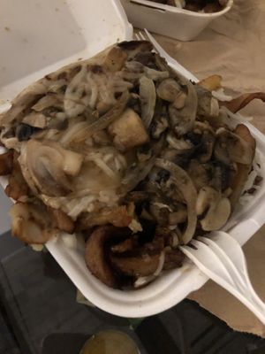 Vegan poutine with mushrooms and onions at La Banquise in Montreal