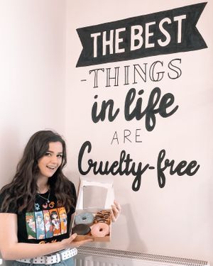 Paintings on the wall 🌿🍩🤘🏼 at Blue Vegan Pig Shop in Prague