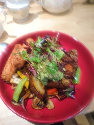 Potatoes with extra avocado and vegan sausage at The Orchard Cafe in Worthing