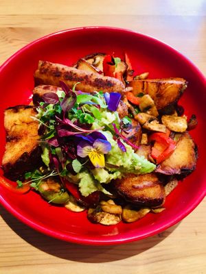 Beautiful orchard potatoes with vegan sausages and avocado  at The Orchard Cafe in Worthing