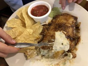 Enchilada before my kid scraped the mole of to the side  at Mexicali in Makati