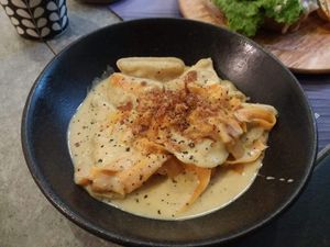 Dumplings with potato "cheese", "bacon", carrot at Elephant in the Room in Thessaloniki