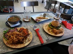 Mushroom soup, seitan burger, lentil sausages and "cheese" balls at Elephant in the Room in Thessaloniki