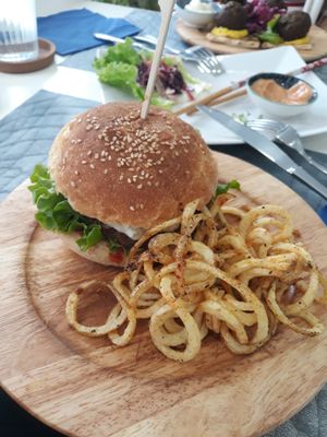 Vegan burger with curly fries. at Elephant in the Room in Thessaloniki