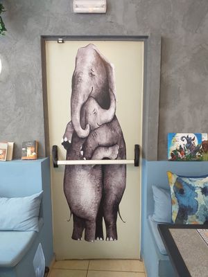 The most beautiful Fire Exit Door mural ever! 💚 at Elephant in the Room in Thessaloniki