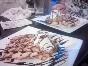 Waffle stack with chocolate sauce and ice cream at güd eats in Saskatoon