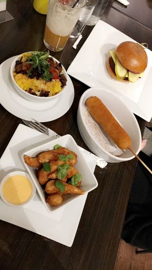 Burger, Mac'n cheeze, corn dog and coconut skrimp 
(2018) at güd eats in Saskatoon