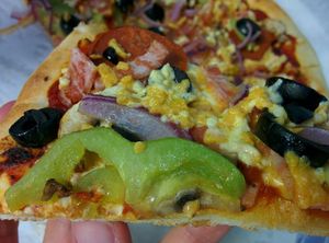 Vegan Kombination pizza (dayia cheese, mushrooms, bell pepper, vegan salami, vegan bacon) at Razzos Pizza And Salads in Hayward