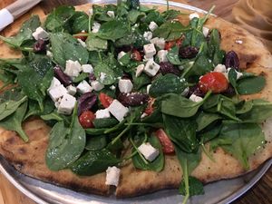 Greek Salad Pizza with tofu feta at Pulse Cafe in Hadley